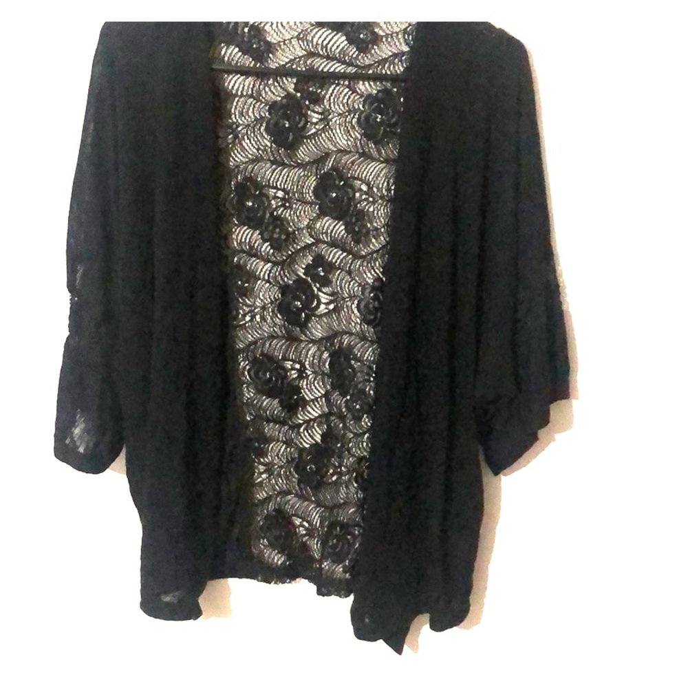 Size small but fits like a med over sized sweater